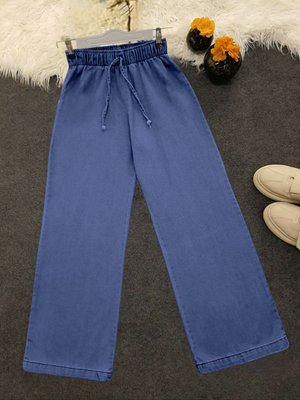 Bol Paça Beli Lastikli Bağcık Detaylı Kot Pantolon