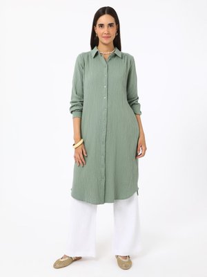 Beyaz Pamuklu Müslin Kumaş Bağlama Detaylı Pantolon Beyaz Pamuklu Müslin Kumaş Bağlama Detaylı Pantolon