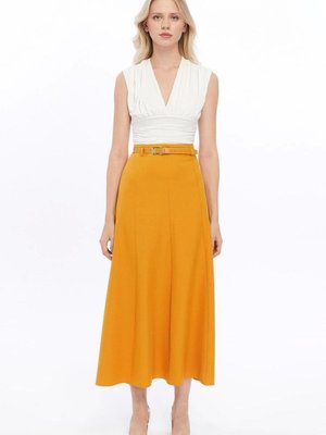 Hardal Uzun Mevsimlik Kemer Detaylı Parçalı Kloş Etek Hardal Uzun Mevsimlik Kemer Detaylı Parçalı Kloş Etek