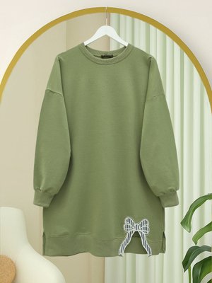 Çağla Y. Yuvarlak Yaka Eteği Fiyonk Detaylı Salaş Penye Tunik Çağla Y. Yuvarlak Yaka Eteği Fiyonk Detaylı Salaş Penye Tunik